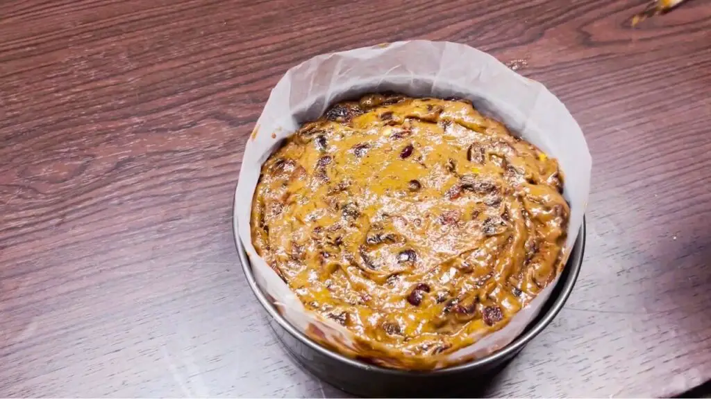 combining easy fruit cake recipe ingredients