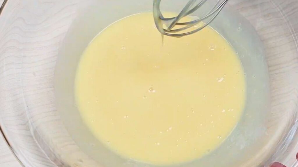 mixing of egg salt and condensed milk for moist loaf cake recipe