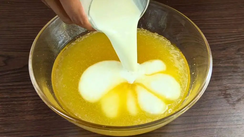 adding milk to the marble loaf cake batter