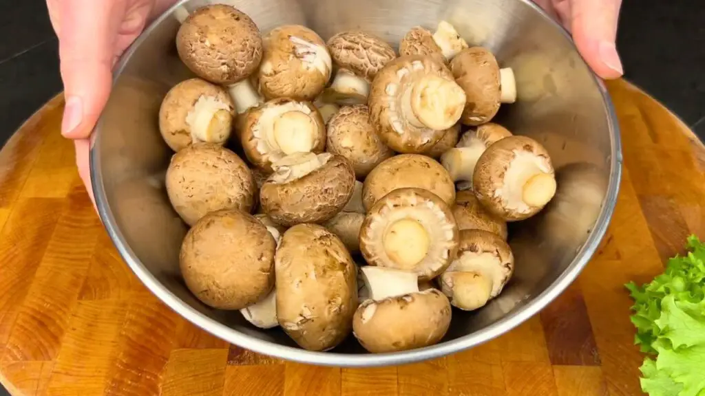 Fresh whole mushrooms in a bowl, ready to be used in an easy air fryer recipe