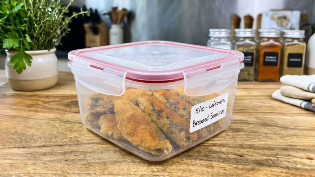 sardines in a plastic storage container 