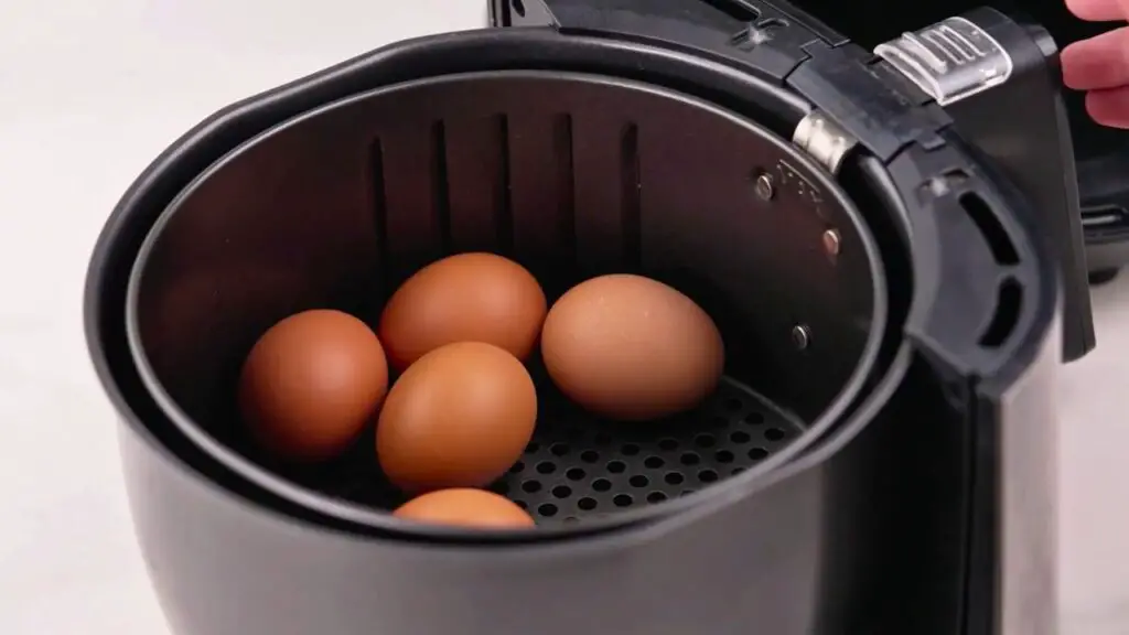 Do not stack the eggs or pack them in tightly. Leave a little space between them so the hot air can cook the air fryer eggs evenly.