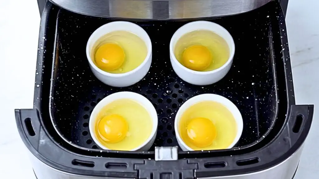 Grease a heat-safe ramekin, crack an egg into it, and cook