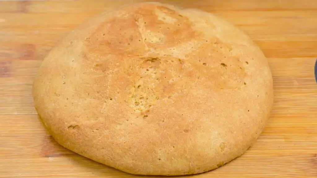 Whole wheat bread on a cutting board, cooled and ready for storage