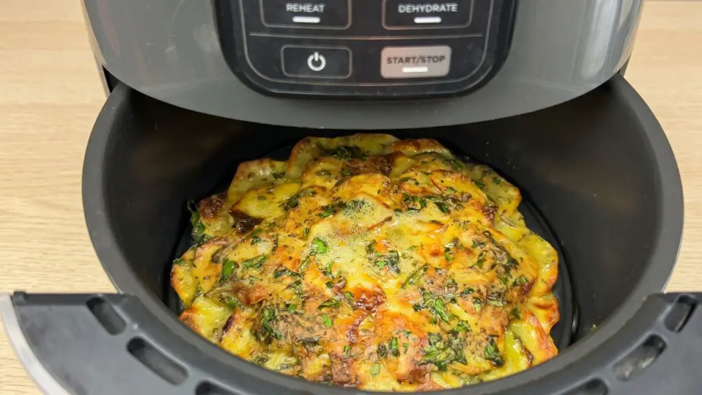 sliced potatoes in an air fryer