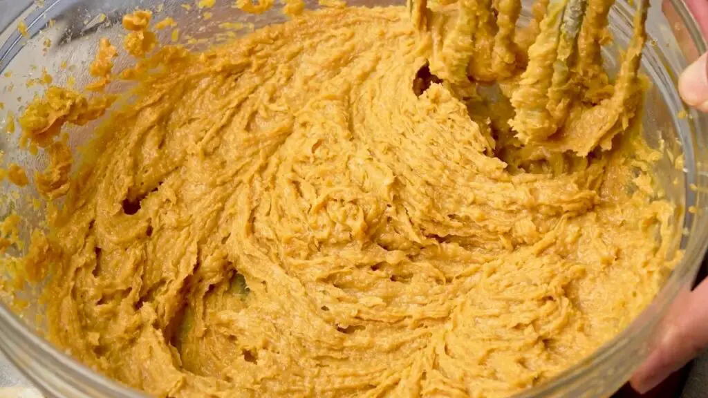 Peanut butter cookie batter mixed with egg and vanilla until smooth and creamy.