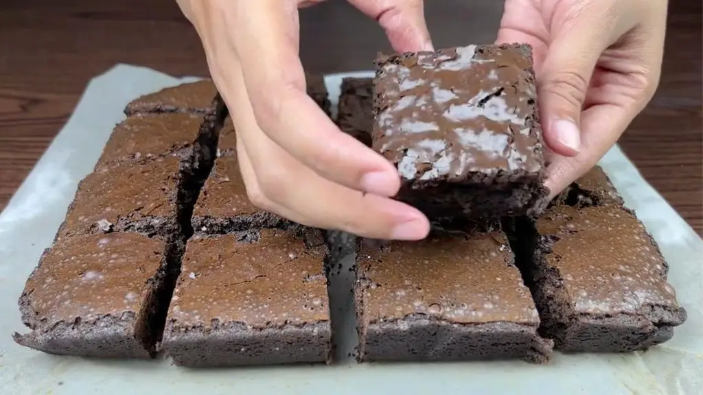 Brownies with crackly top showing the thin, shiny crust that forms on perfectly baked fudgy brownies.