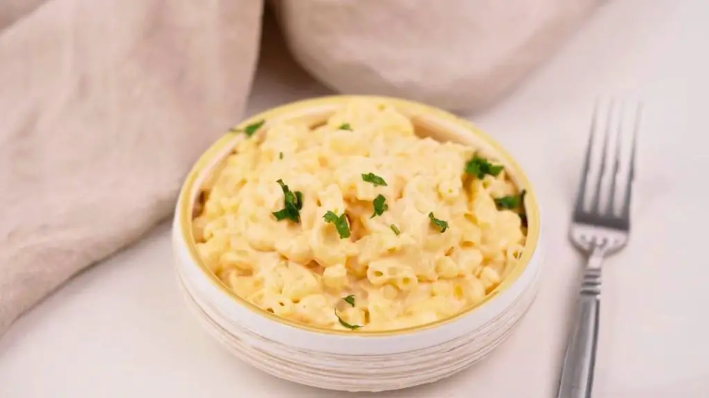 Creamy slow cooker mac n cheese served in a bowl, showing the rich and cheesy texture of the finished dish.