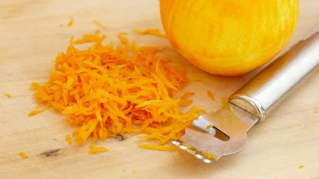 Orange zest prepared for an easy yogurt cake swap, adding a fresh citrus flavor that pairs well with yogurt.