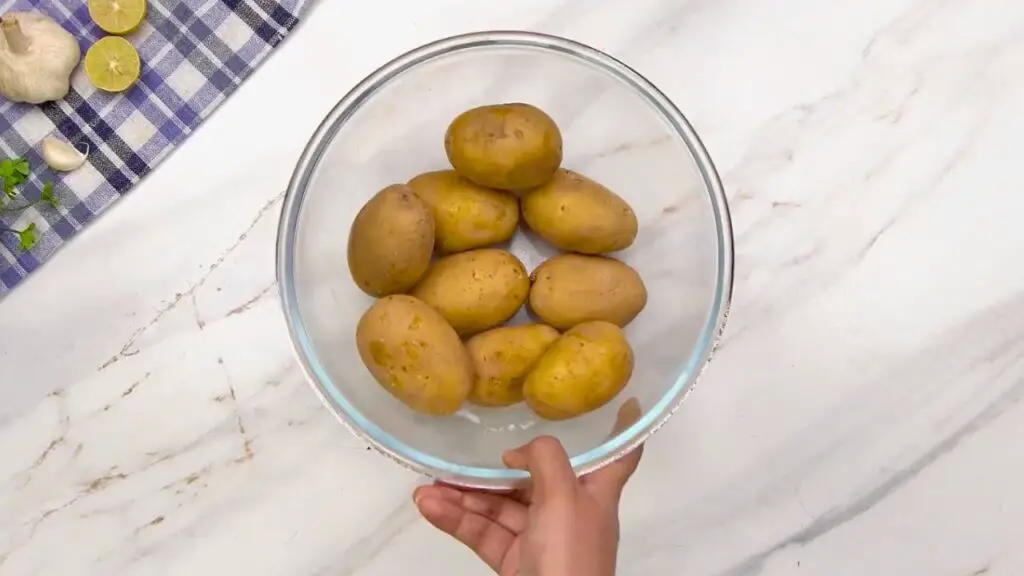 Small potatoes for cooking alongside chicken in a glass air fryer.