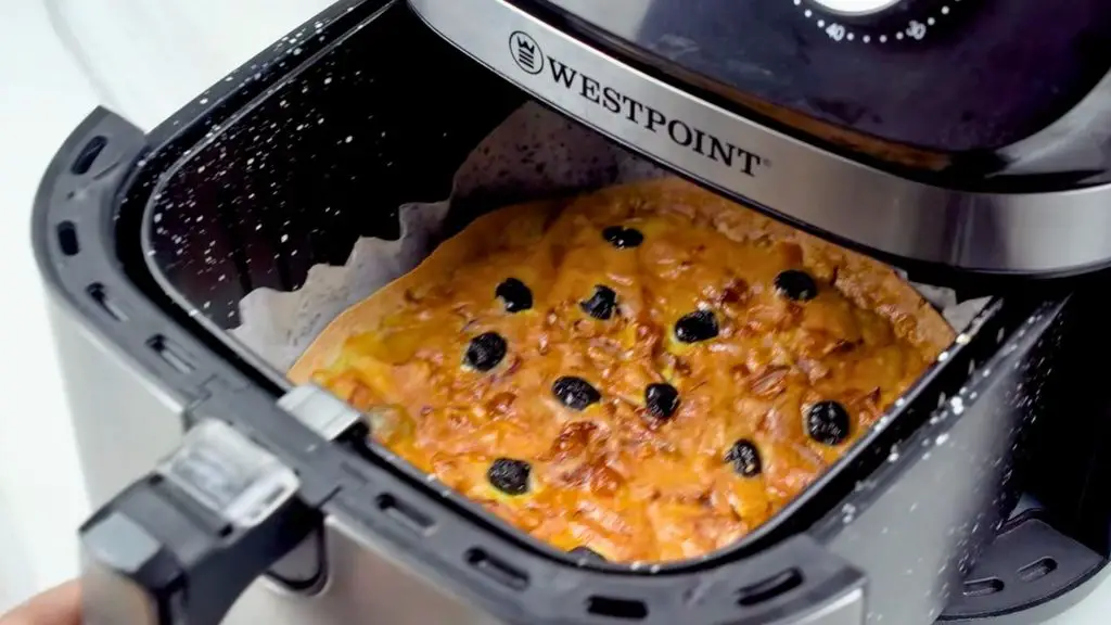 Air fry the breakfast pizza until the eggs are set, the cheese is melted, and the top is lightly golden and bubbly.