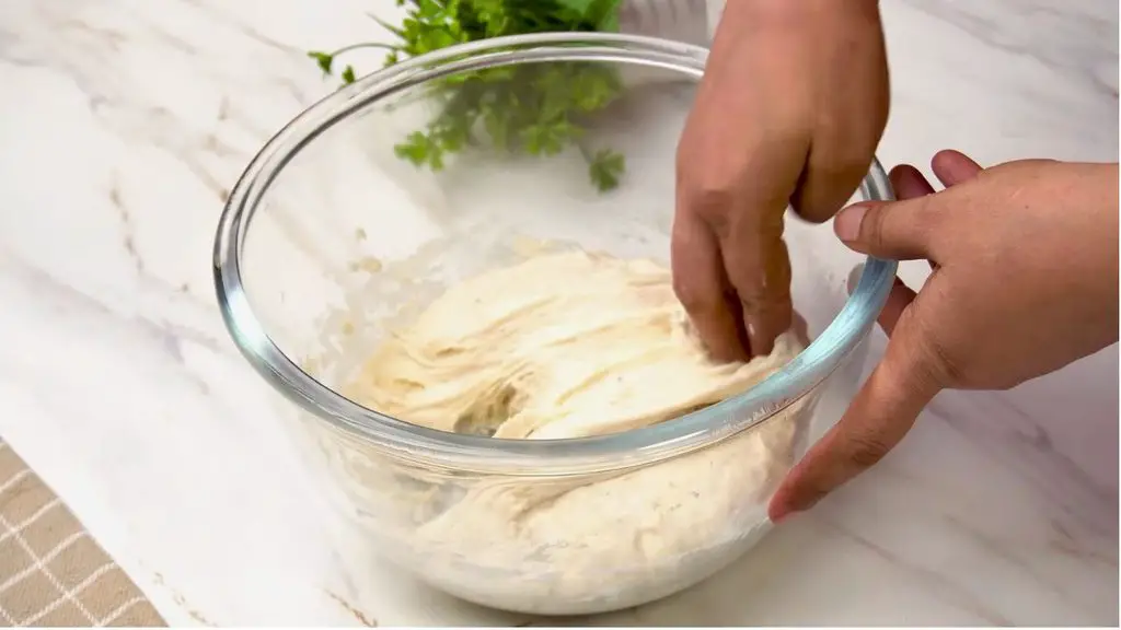 Stretching and folding the dough helps this homemade bread develop structure without kneading.